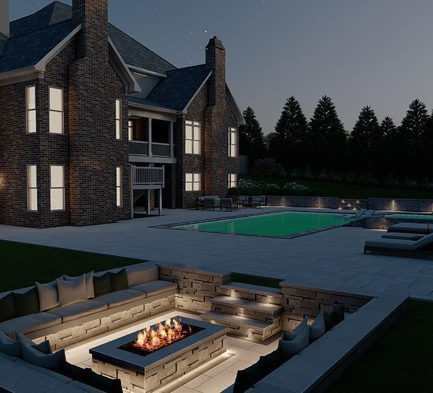 A large brick house with a swimming pool and a fire pit in front of it