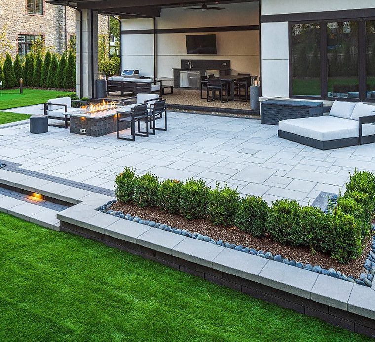 There is a fire pit in the middle of the patio.