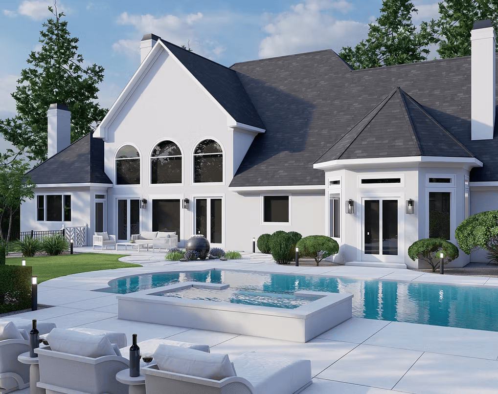 A large white house with a swimming pool in the backyard.