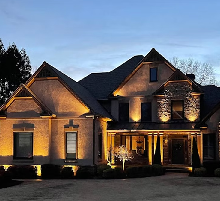 A large house that is lit up at night