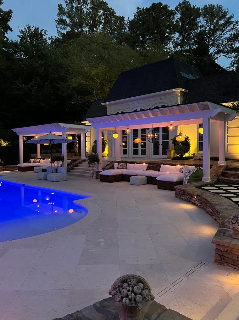 A large house with a swimming pool in front of it