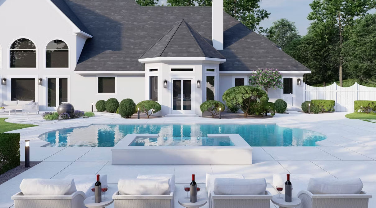 A white house with a large swimming pool in front of it.