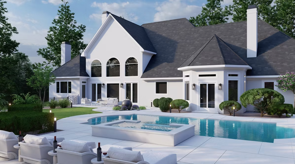 A large white house with a swimming pool in the backyard.