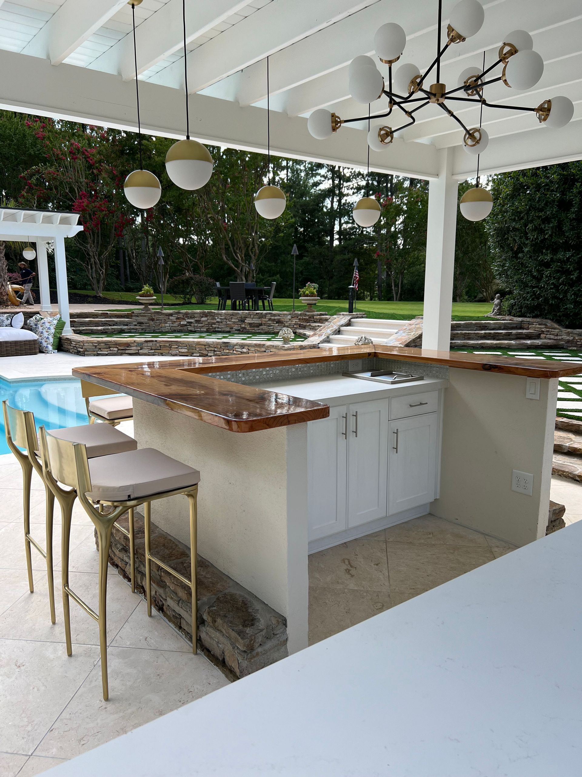 A kitchen with a large island and stools