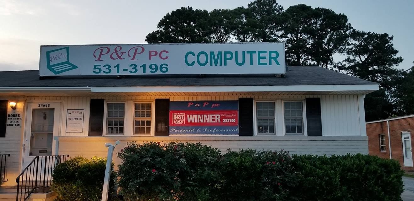 a building with a sign that says p & p pc computer