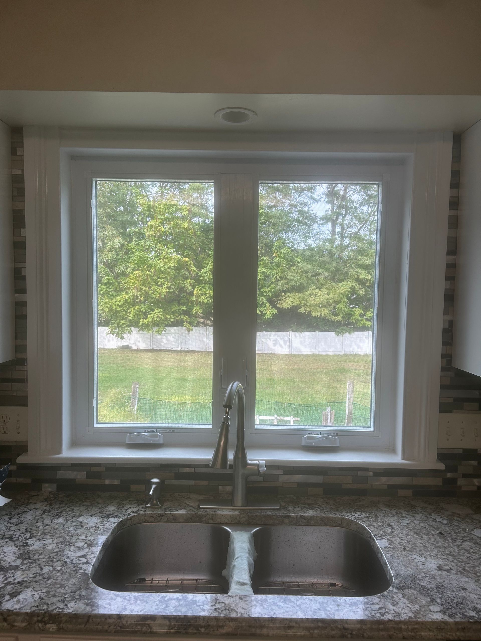 The inside of a moving truck filled with boxes and blankets.