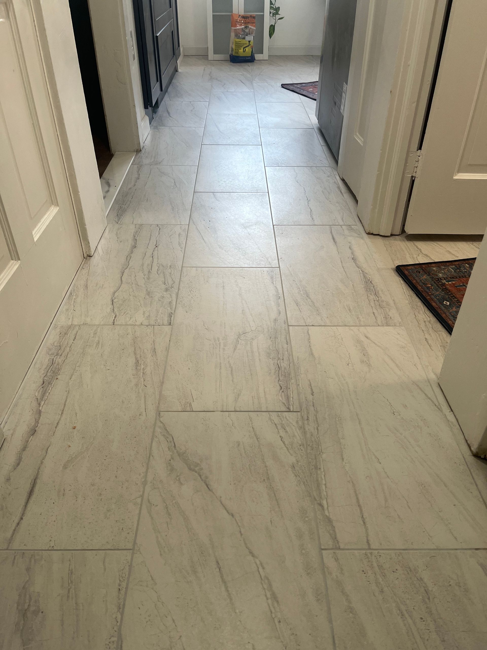 The inside of a moving truck filled with boxes and blankets.