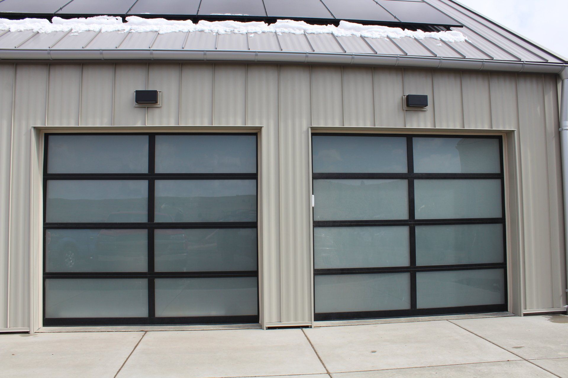 A garage with a solar panel on the roof