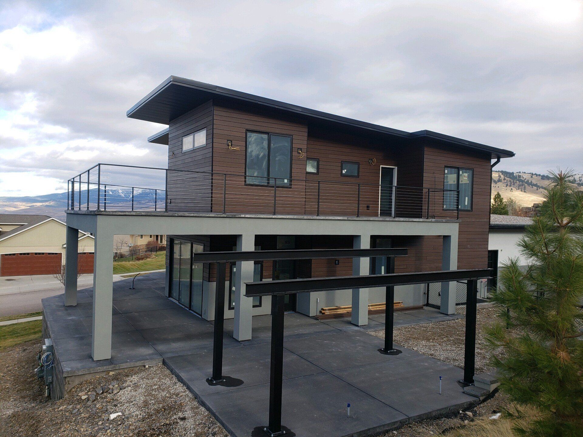 A large brick house with a balcony on top of it.