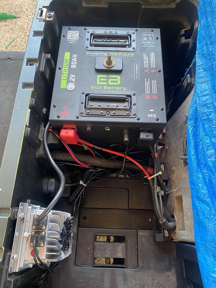 A Battery Is Sitting In The Trunk Of A Vehicle — Lift It Equipment in Summerland Point, NSW