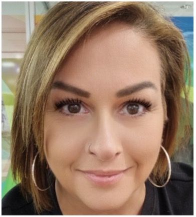 A Close Up Of A Woman 's Face Wearing Hoop Earrings — Lift It Equipment in Summerland Point, NSW