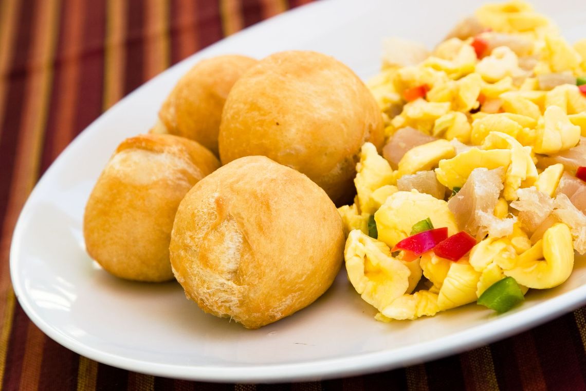 A plate of food with eggs and bread on a table.