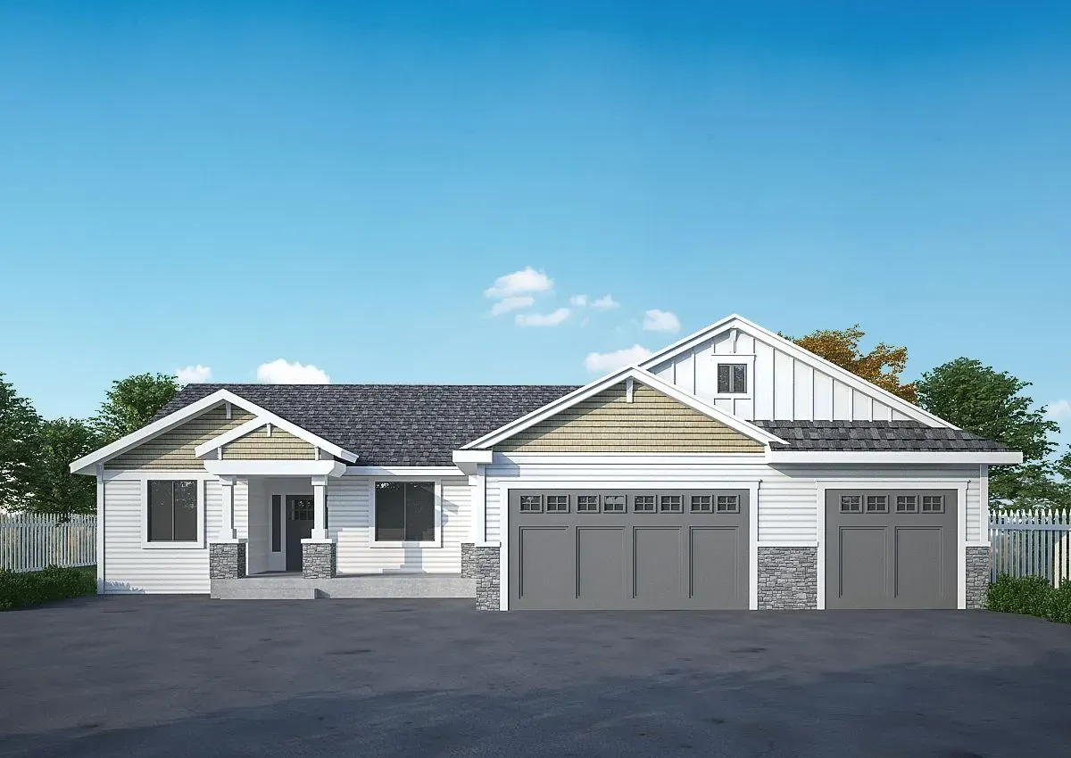 A white house with a gray garage door and a blue sky in the background.