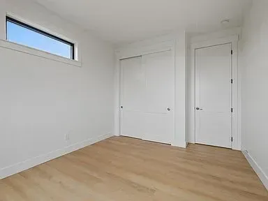 There is a window in the corner of the room.