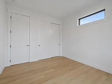 There is a window in the corner of the room.