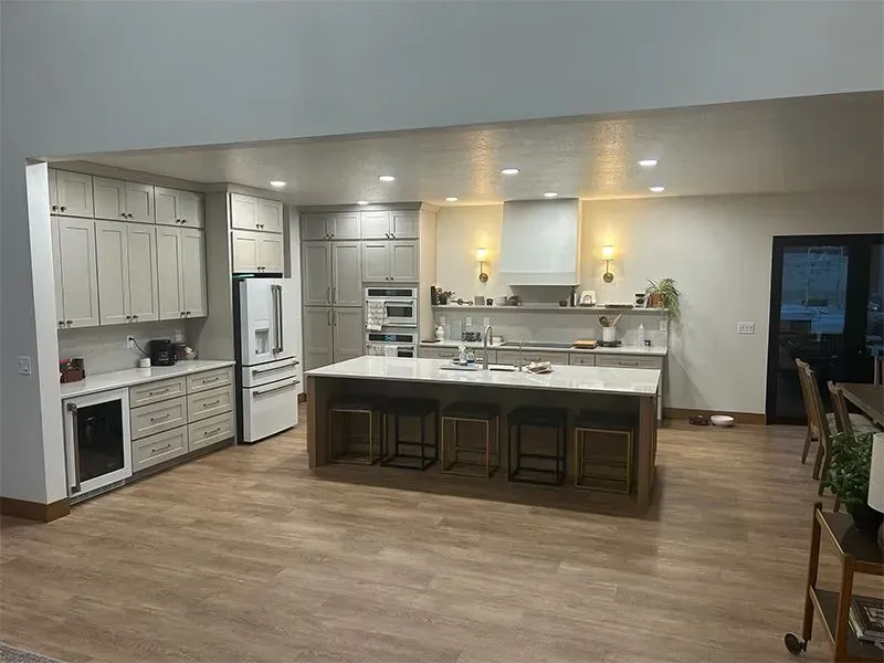 A large kitchen with a large island in the middle of the room.