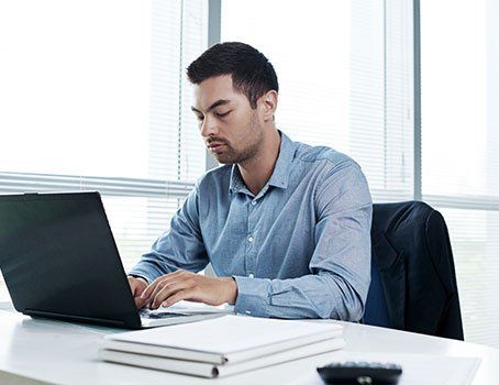 Man working on a computer.