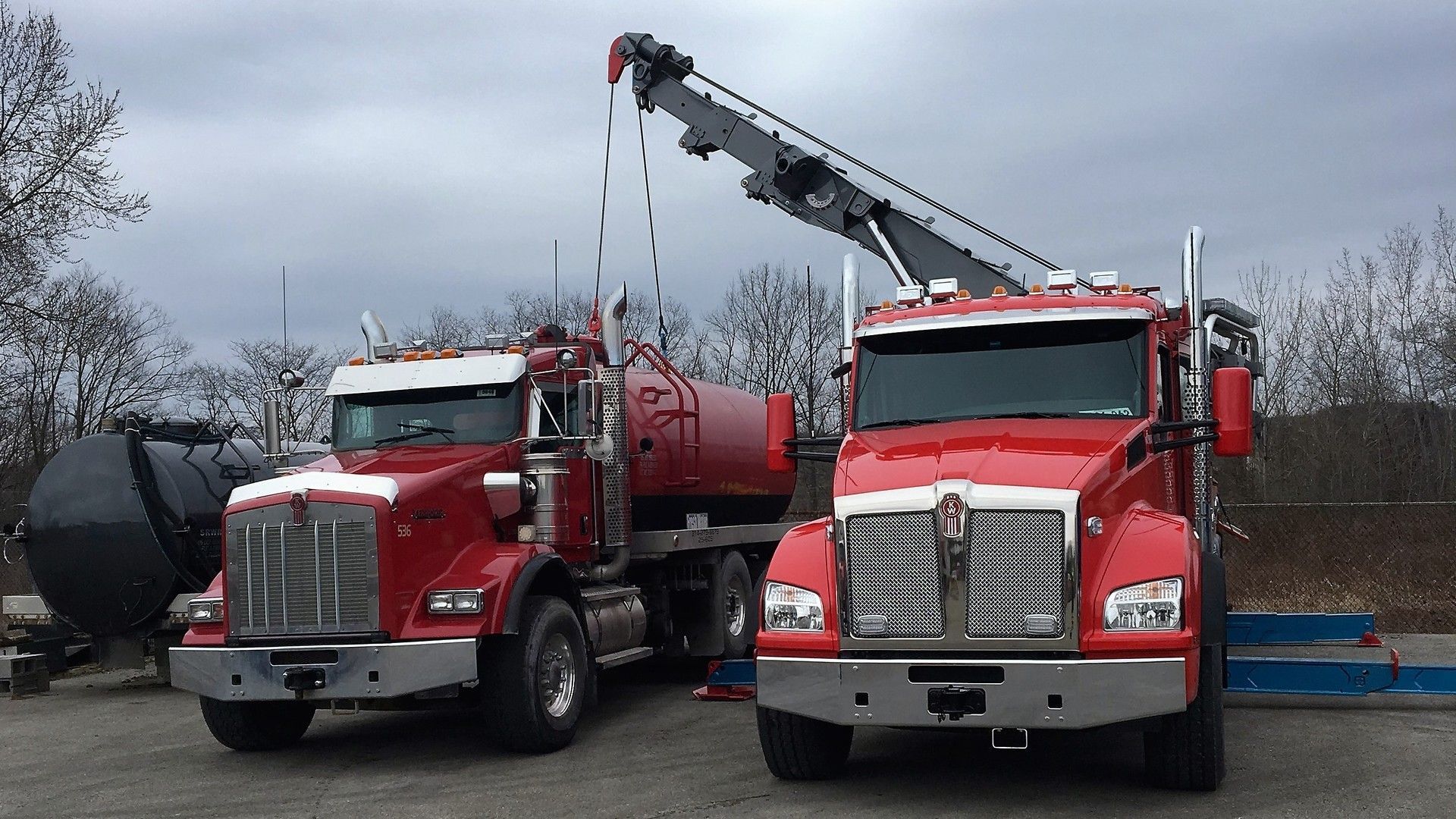 two heavy duty semi truck towing trucks