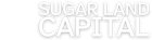 Sugar Land Capital logo in white with a shadow.