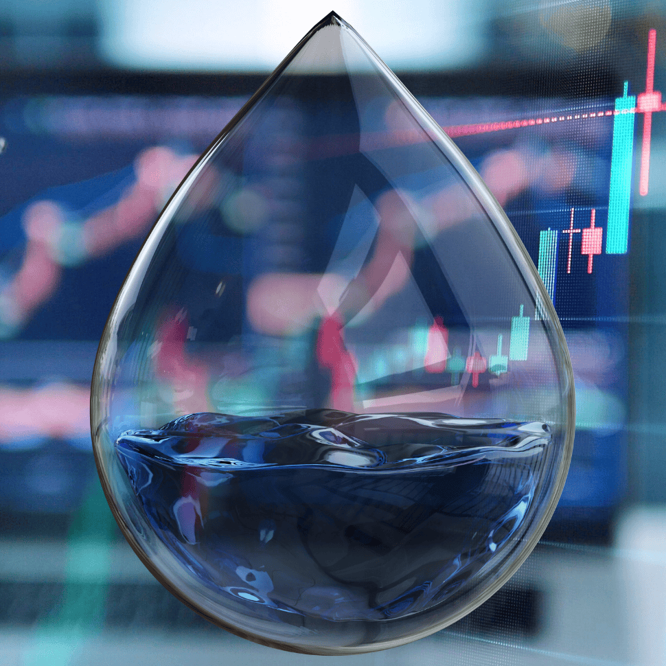 A drop of water with a stock chart in the background.