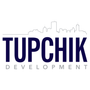 Logo for Tupchik Development with a cityscape outline above dark blue text.