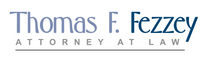 the logo for thomas f. fezziy attorney at law
