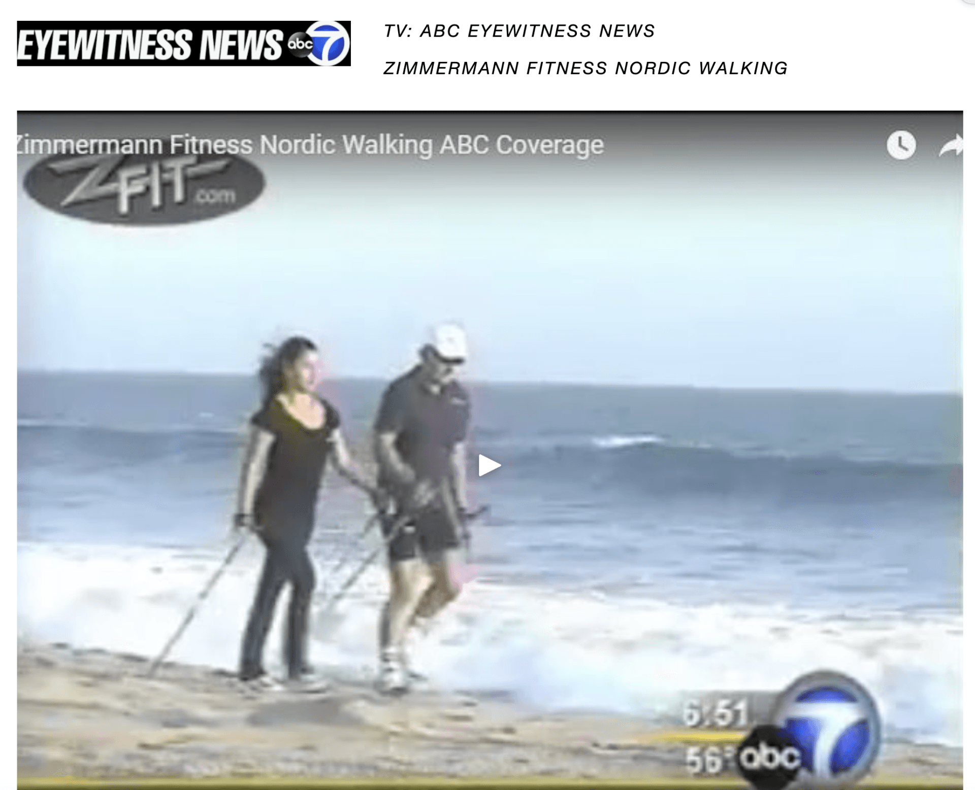 A man and a woman are walking on the beach with nordic walking poles.
