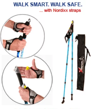 A person is holding a pair of nordic walking poles