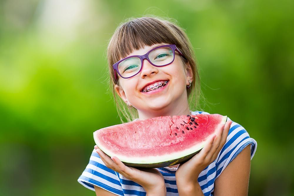 young girl with watermelon