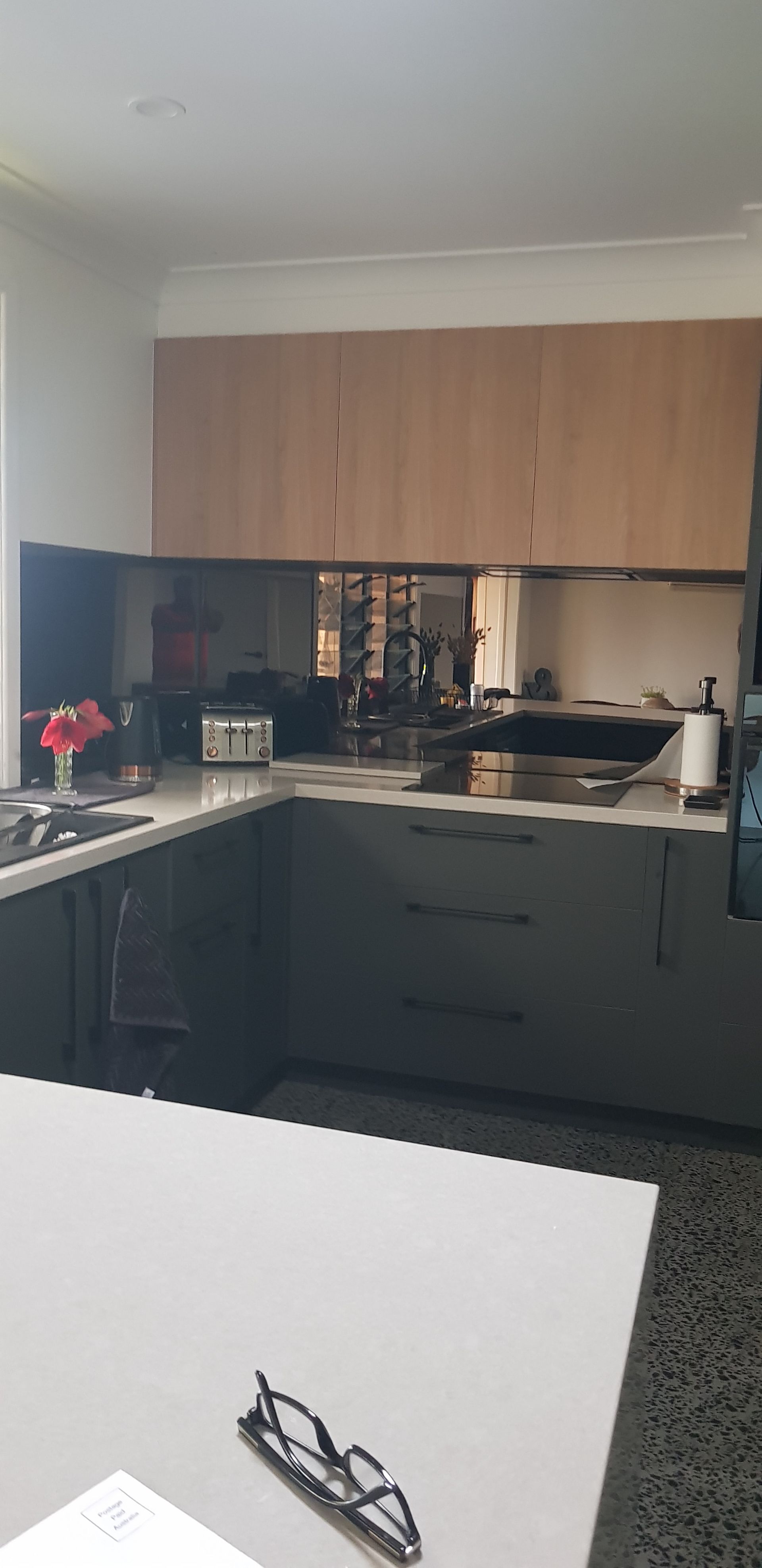An Empty Kitchen With White Cabinets and a Blue Counter Top — Luffys Glass in South Murwillumbah, NSW