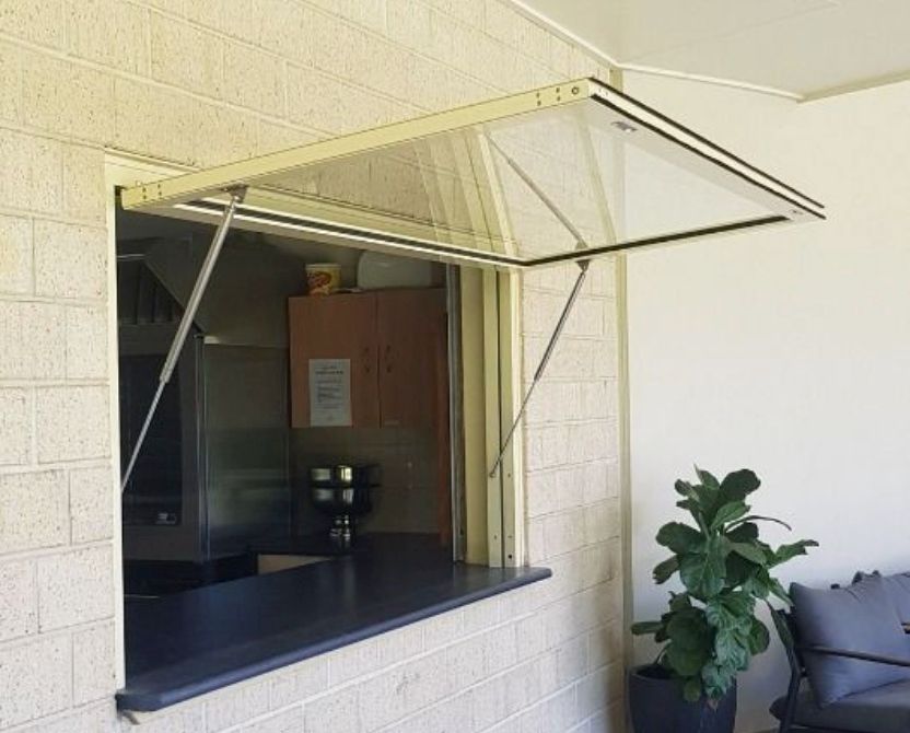 A brick wall with a window that is open — Luffys Glass in South Murwillumbah, NSW