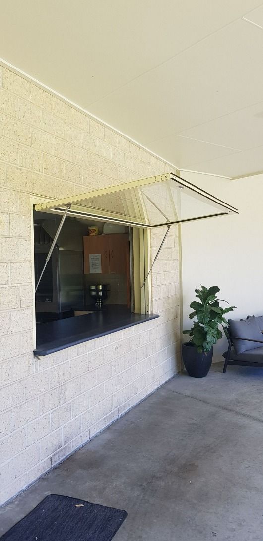 There is a Window on the Side of the Building With a Canopy Over It — Luffys Glass in South Murwillumbah, NSW