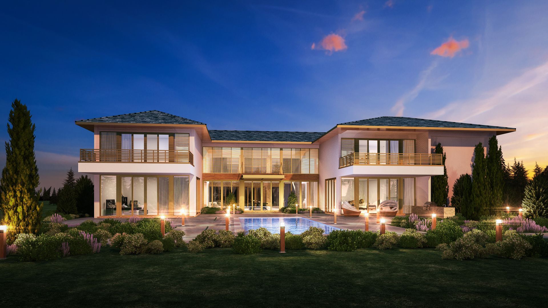 Luxury house with a pool at dusk, lit with warm lights, framed by landscaping and a sunset sky.