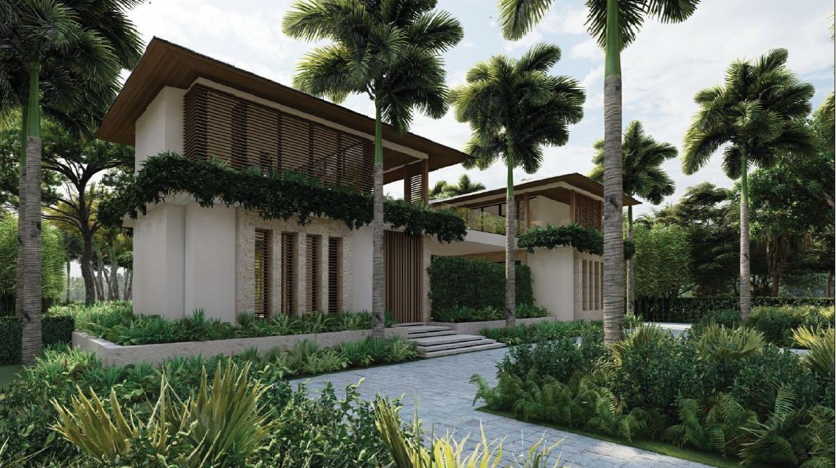 Modern home with a light-colored exterior, wooden accents, and lush landscaping.