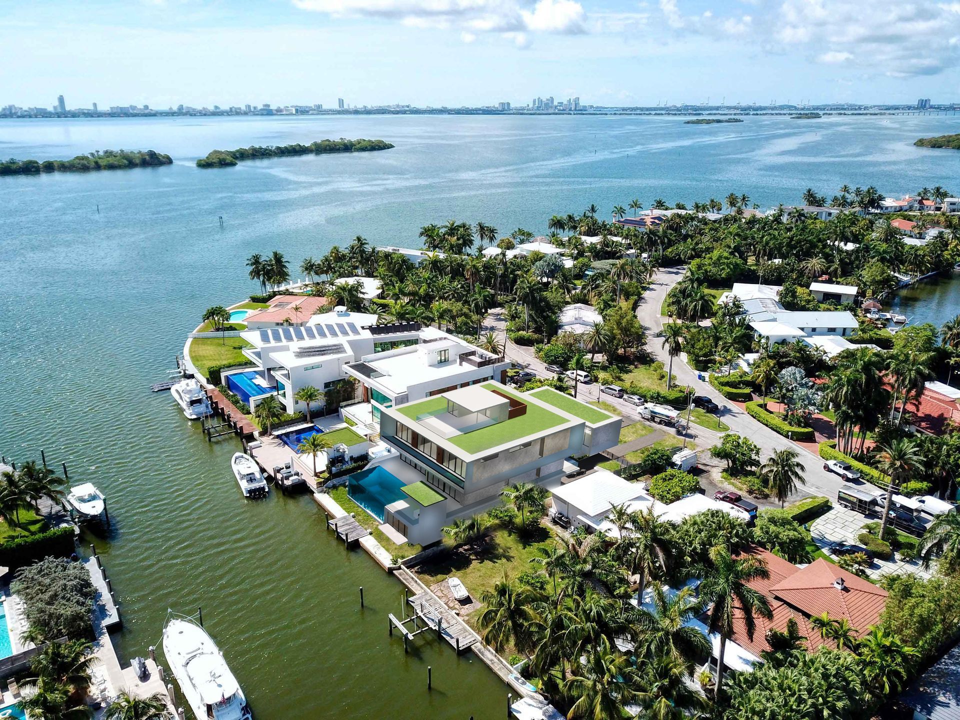 An aerial view of a residential area next to a body of water.