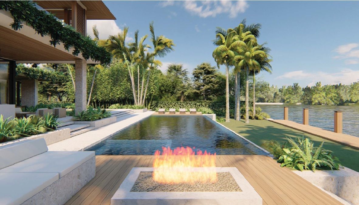 Luxury home exterior with pool, fire pit, and waterfront view.