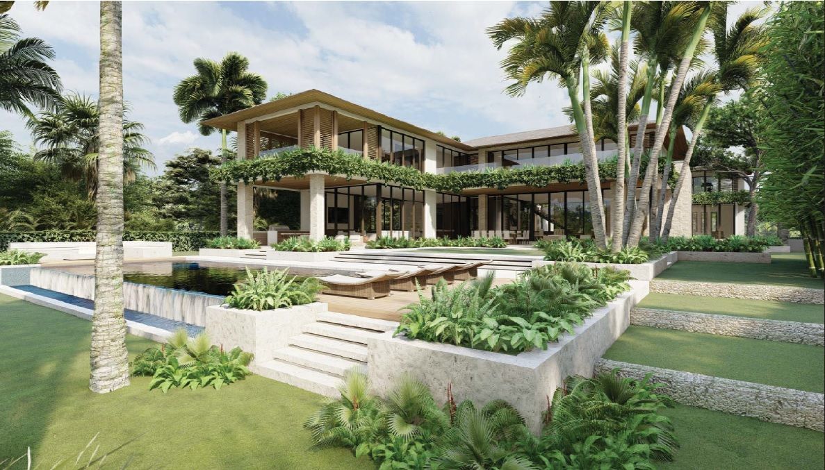 Luxurious tropical villa with pool, palm trees, and lush landscaping.