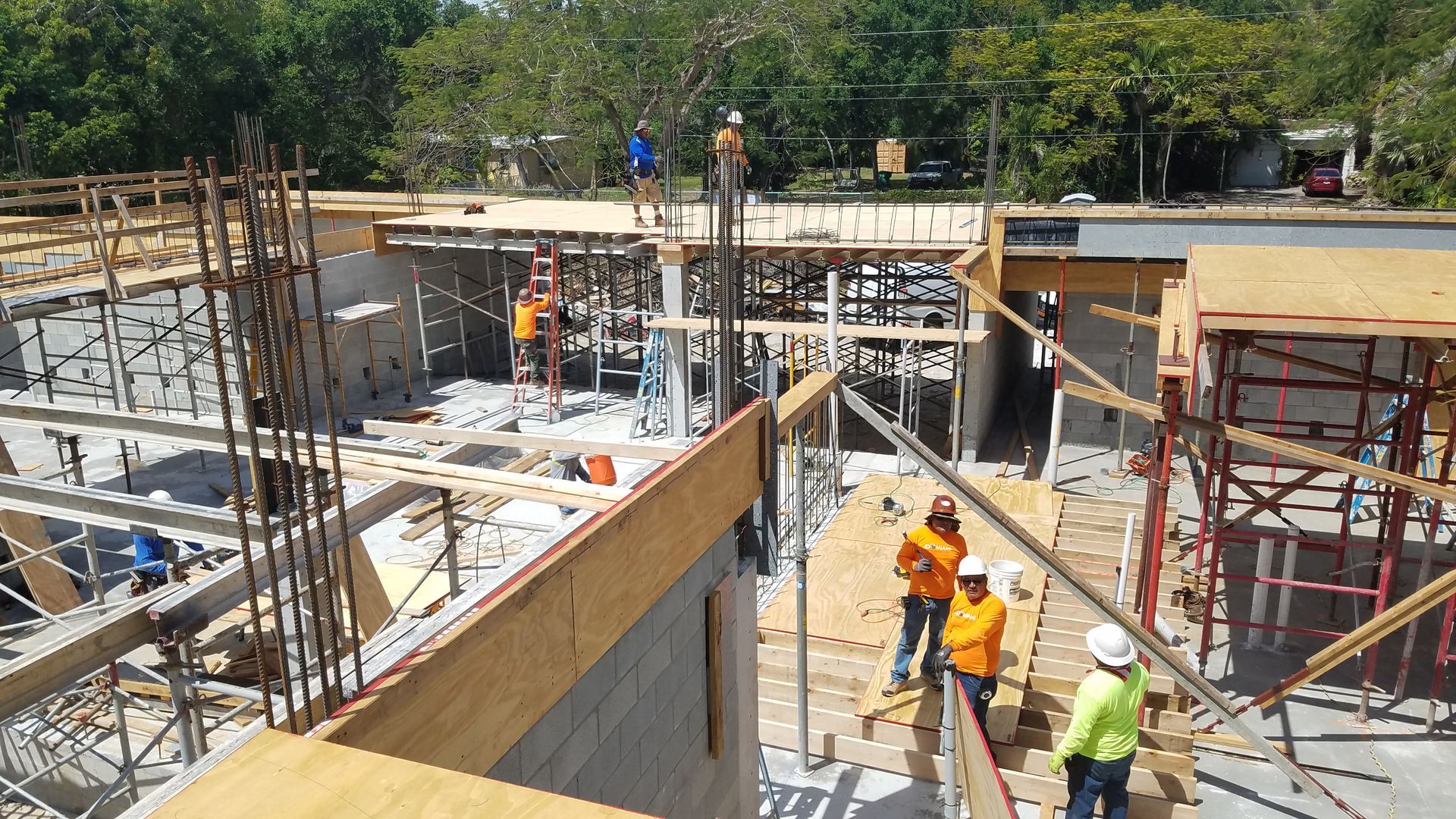 A group of construction workers are working on a building