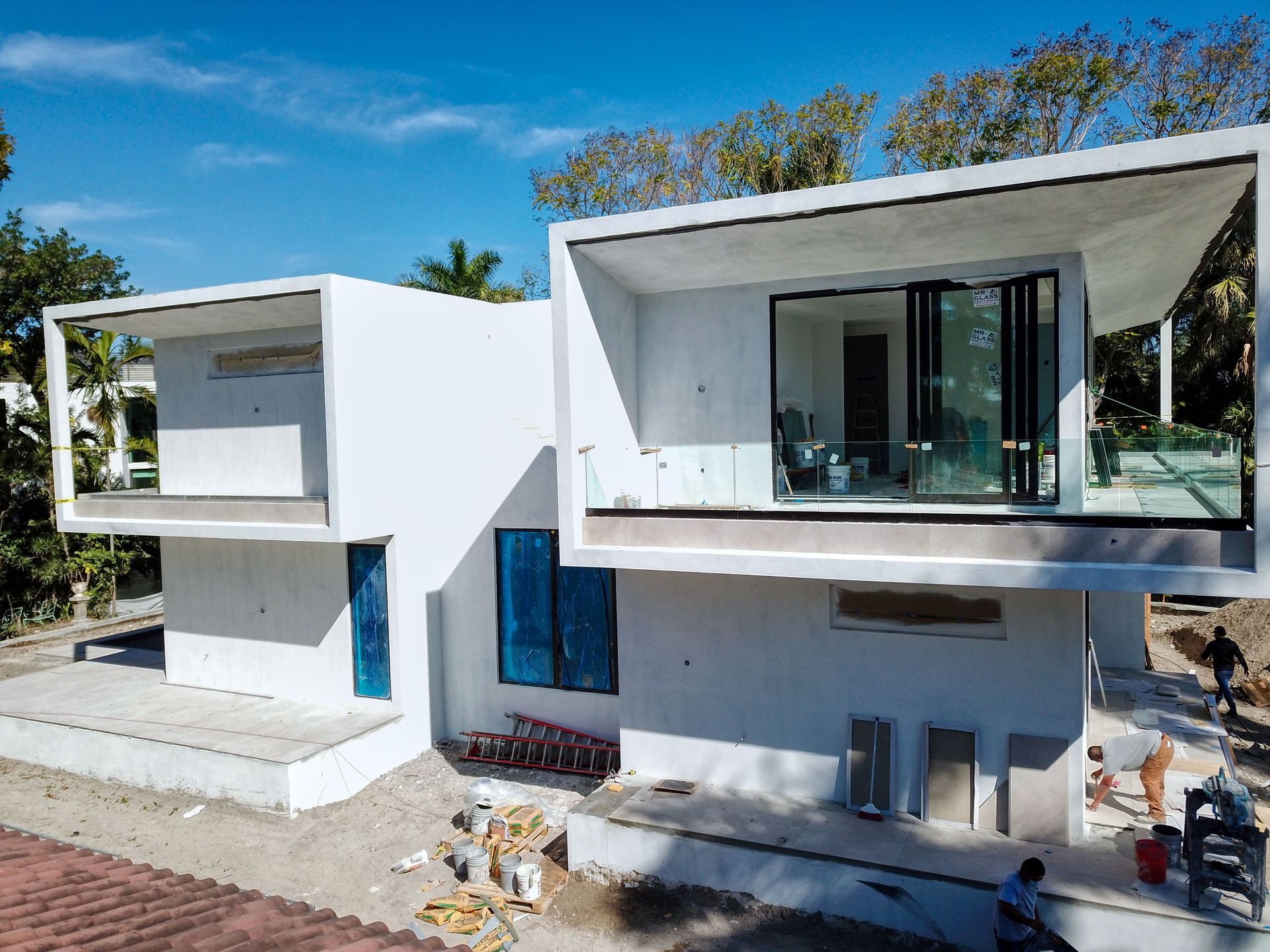 An aerial view of a white house under construction