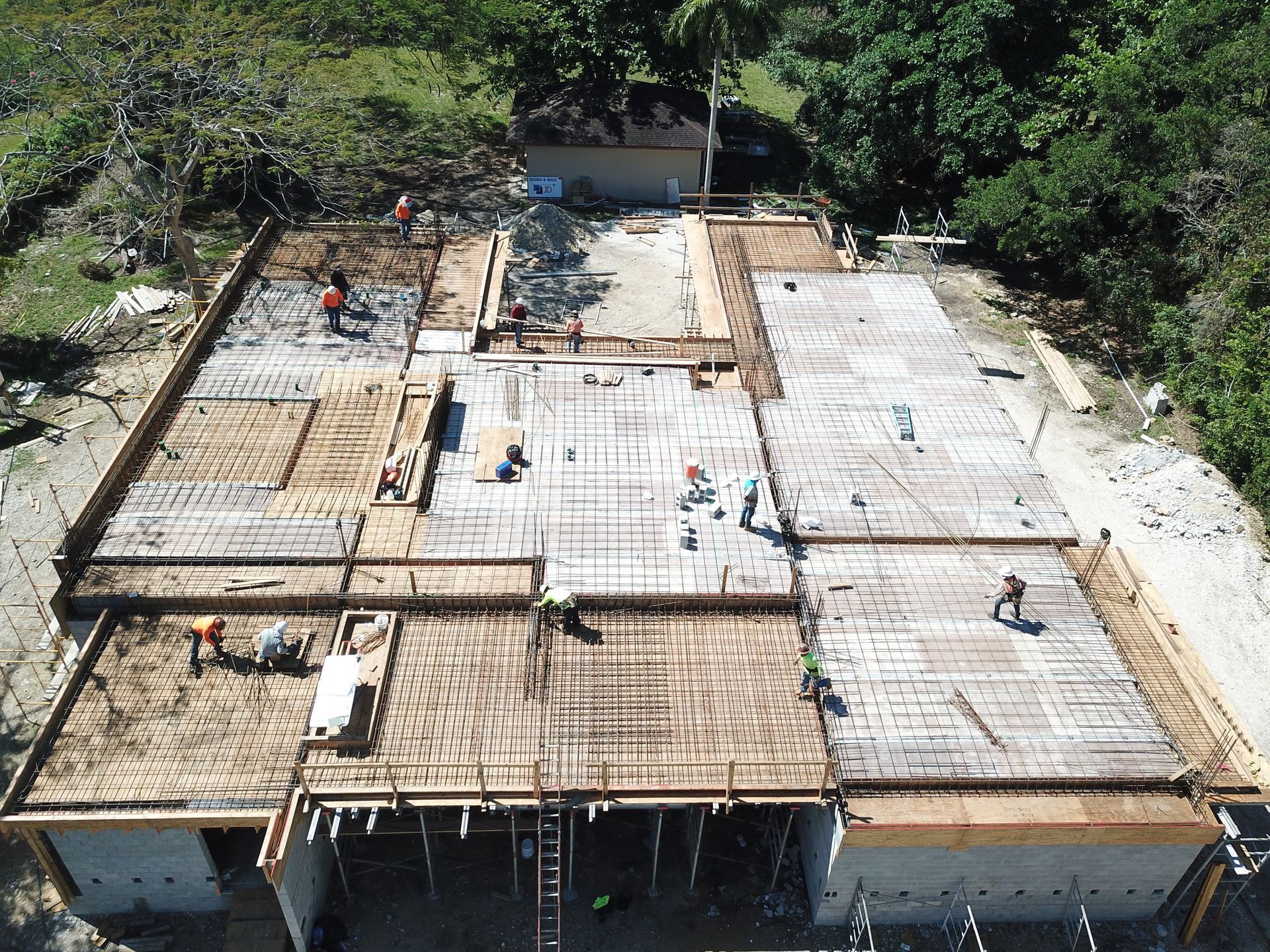 An aerial view of a large building under construction.