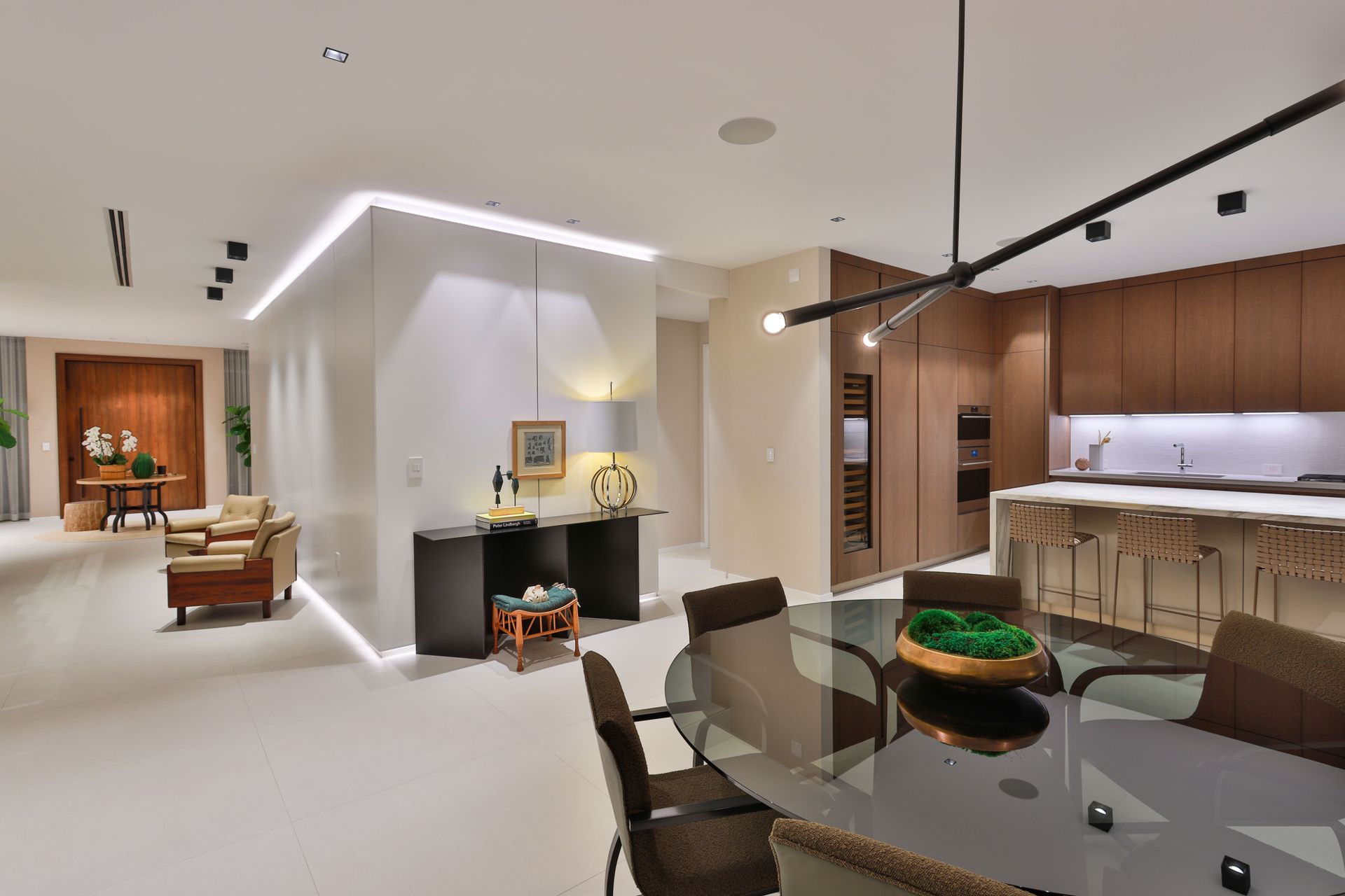 There is a dining table and chairs in the middle of the room.