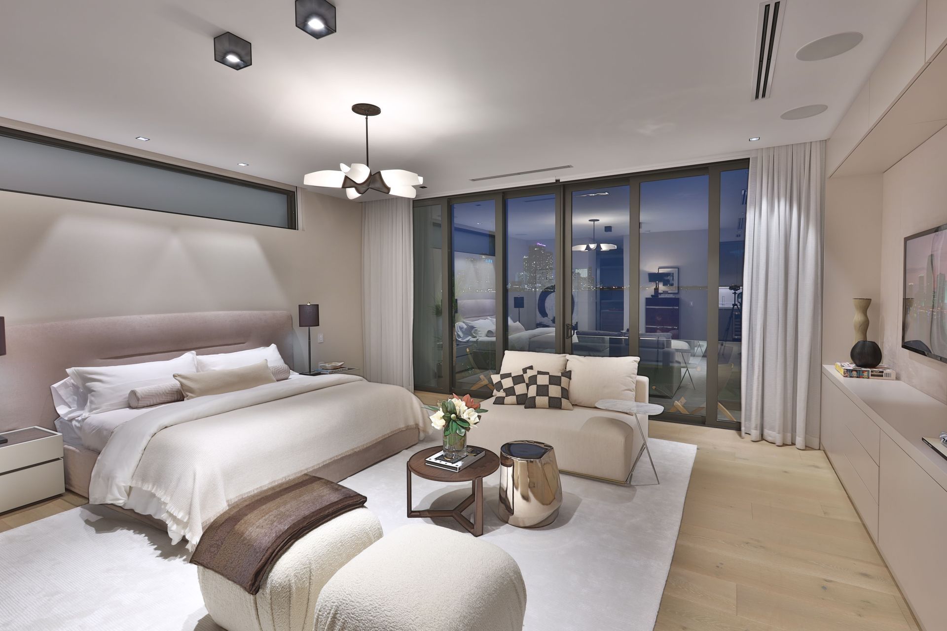 A bedroom with a large bed and a couch