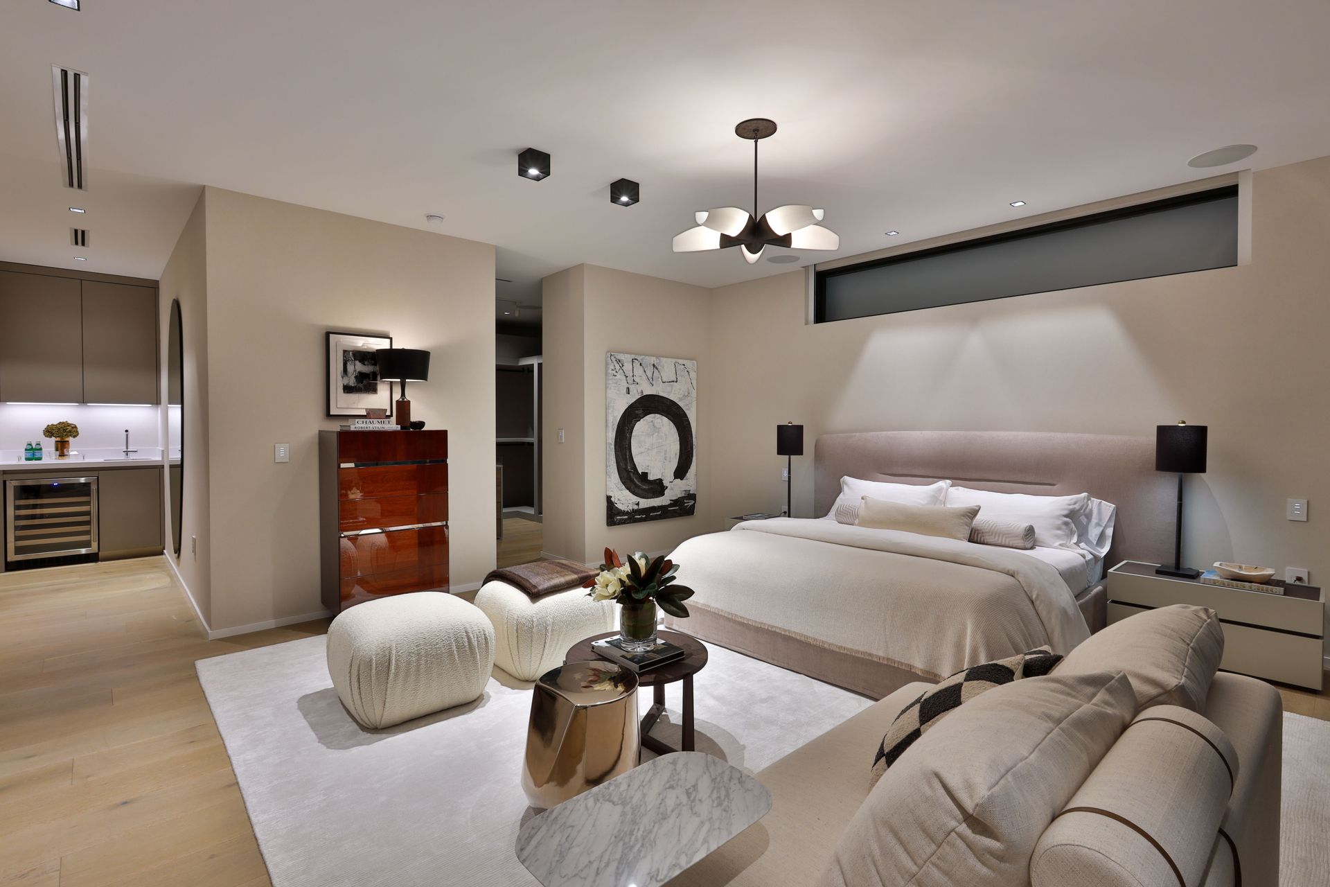 A bedroom with a large bed and a couch