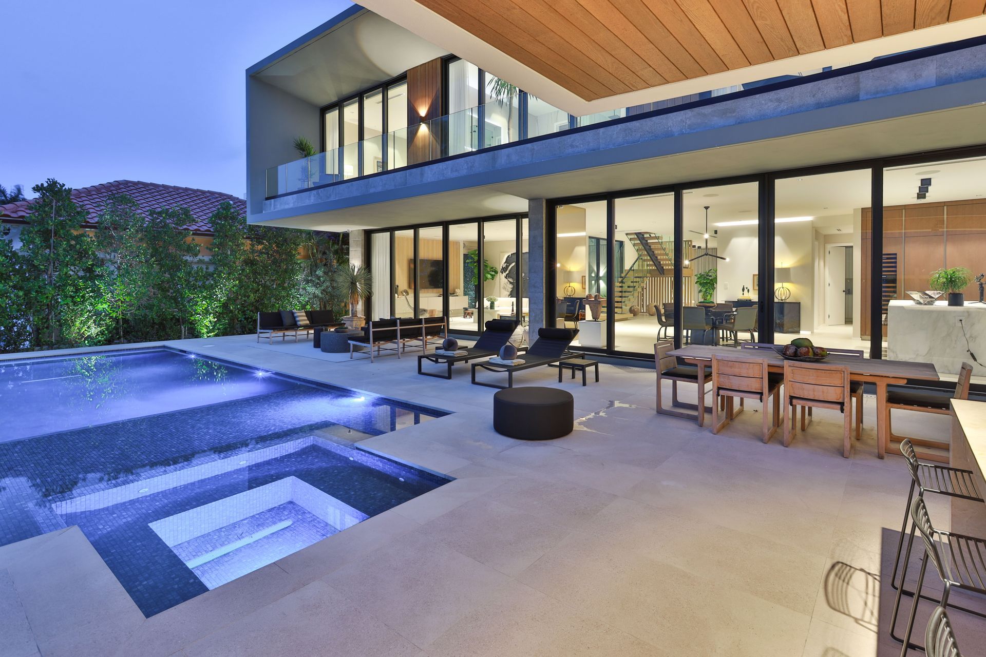 A large house with a swimming pool and a patio area