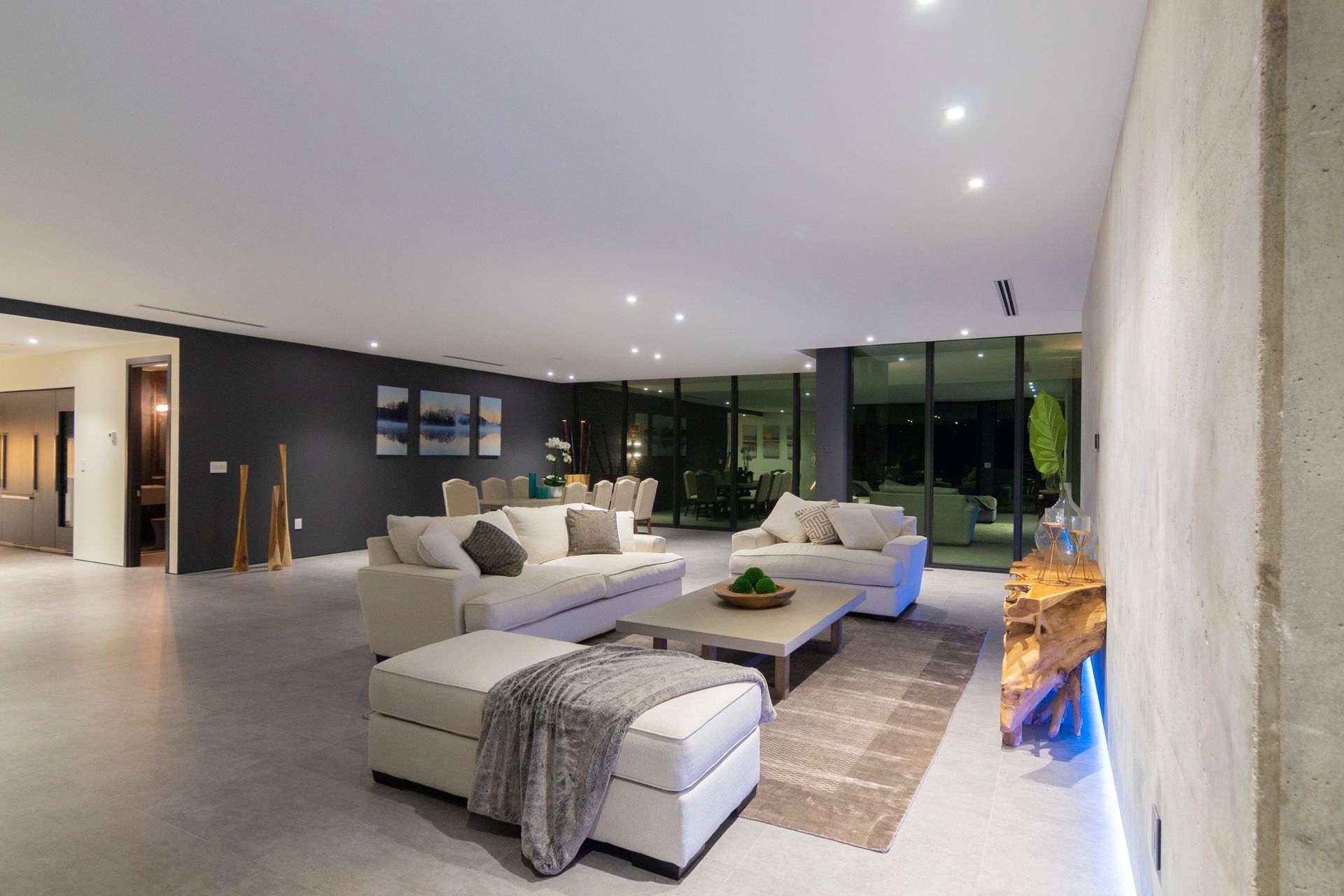 A living room with a lot of furniture and a table