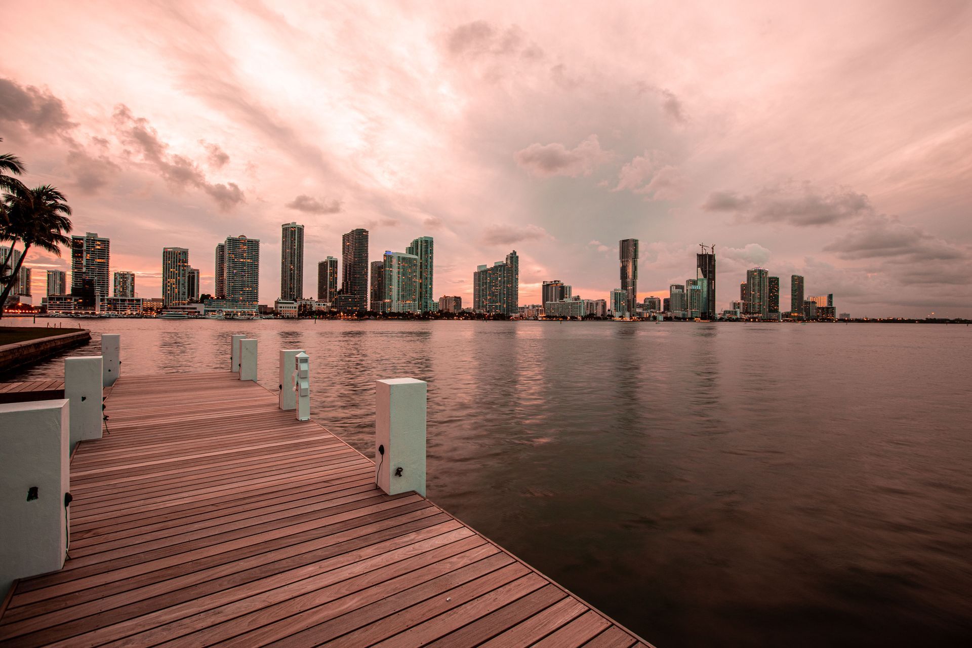 A dock with a city skyline in the background.