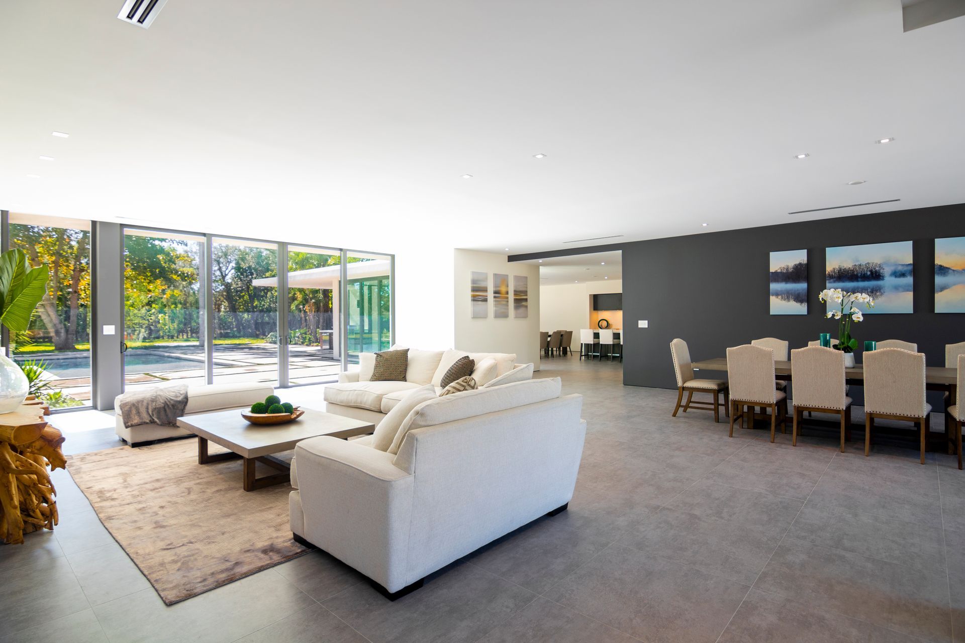 A living room with a white couch and a table