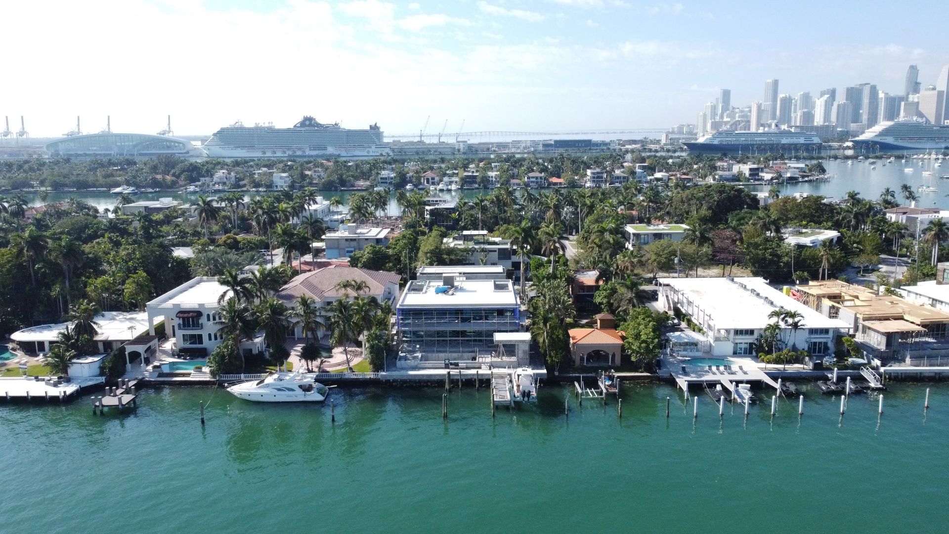 An aerial view of a residential area along a body of water