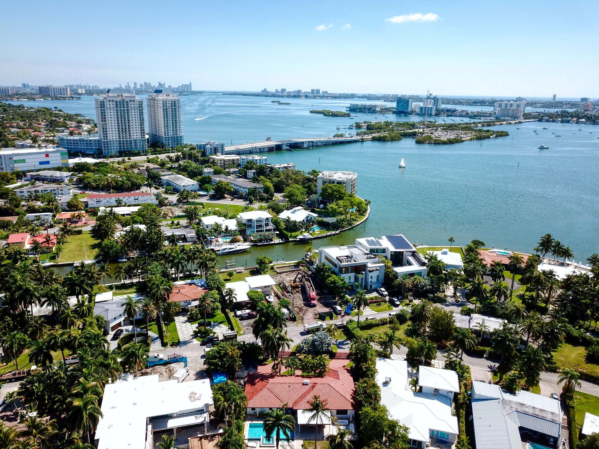 An aerial view of a residential area next to a body of water.