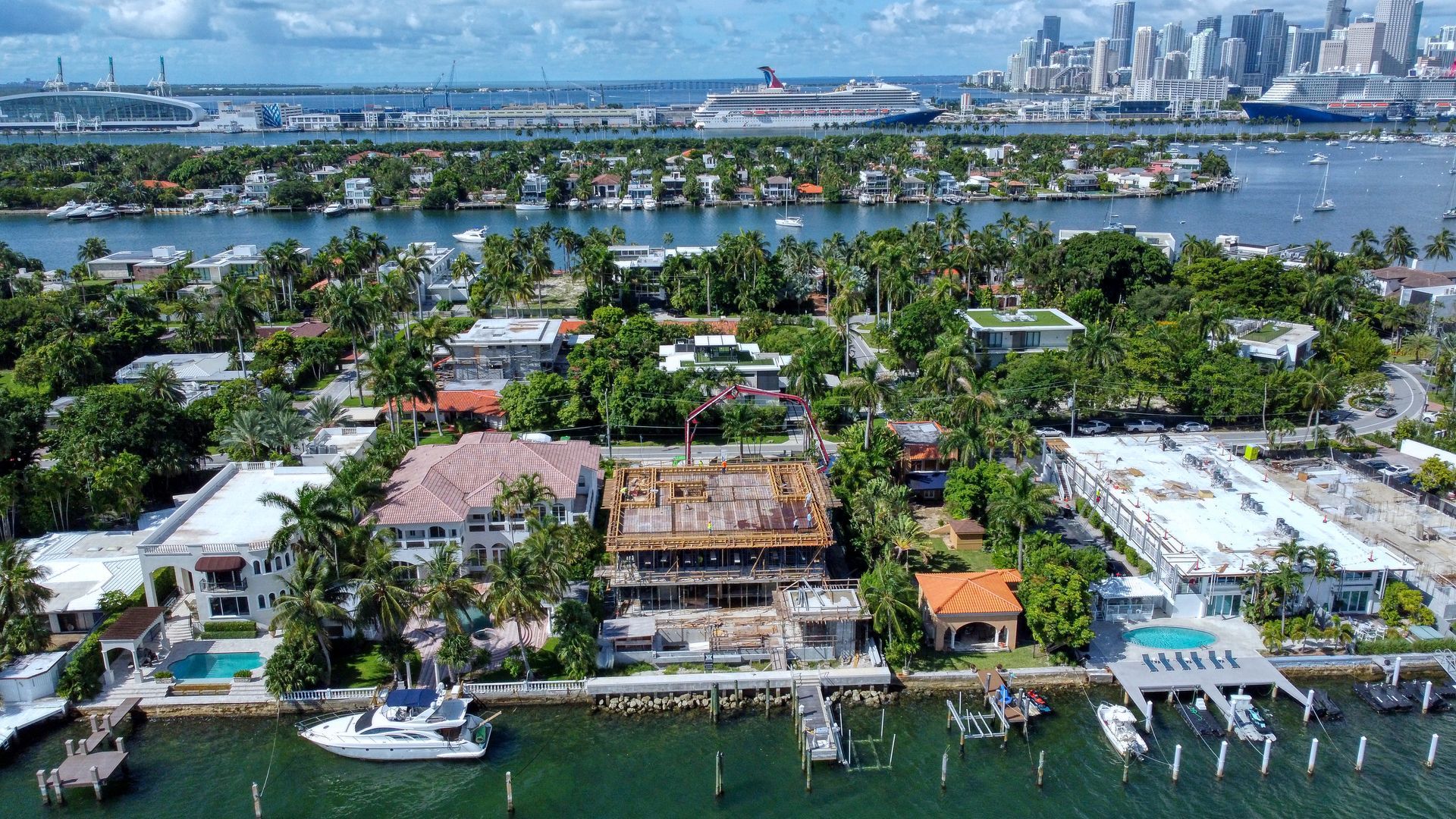 An aerial view of a city with boats in the water